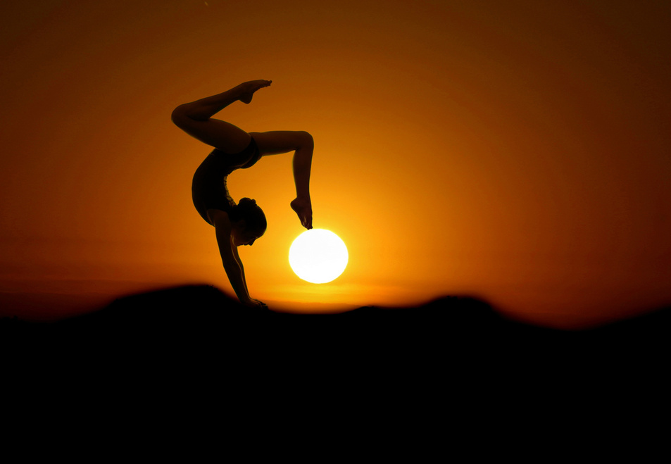 Gymnast Posing in the Sunset